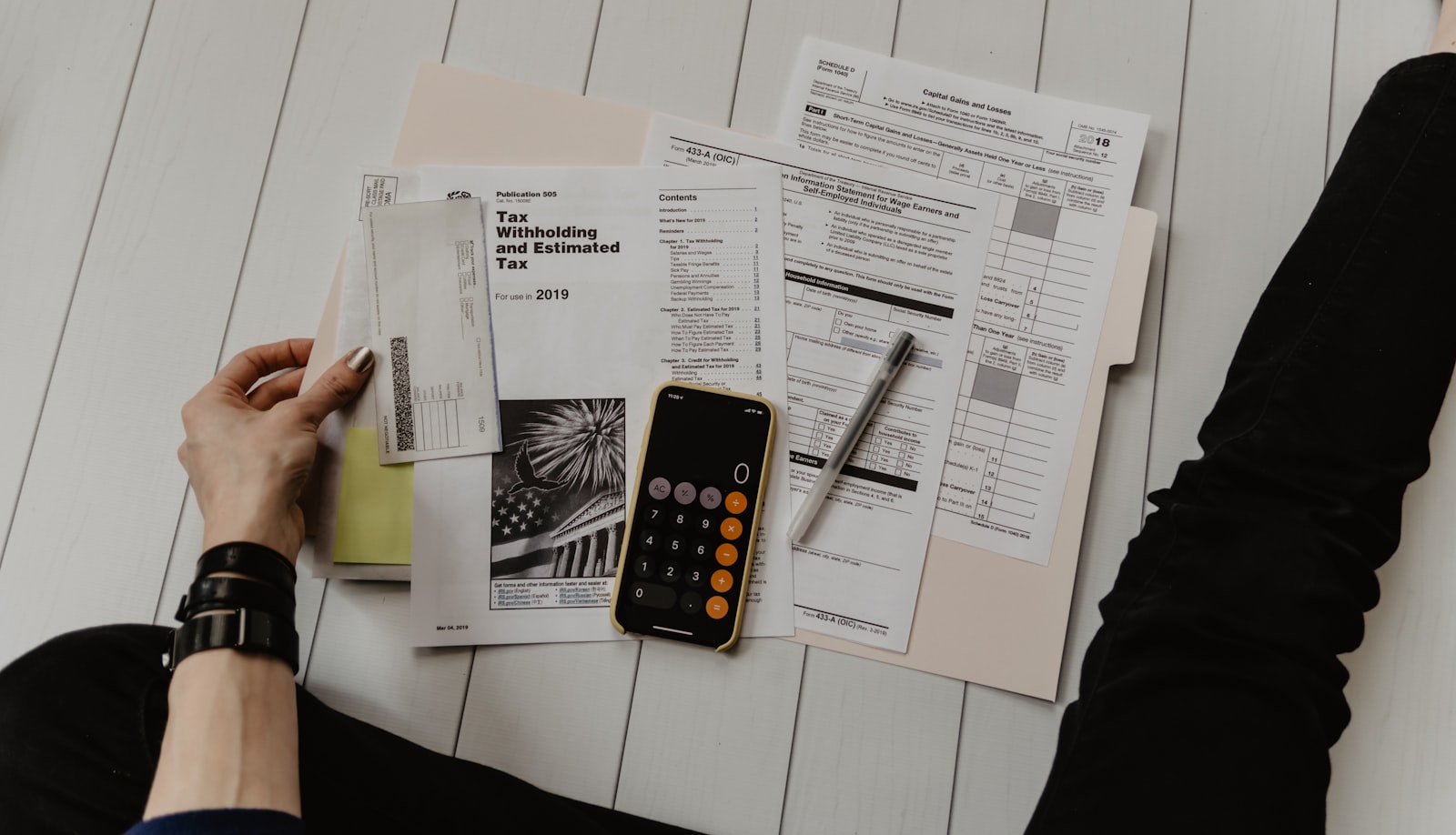 Financial documents, calculator and planning tools on a desk